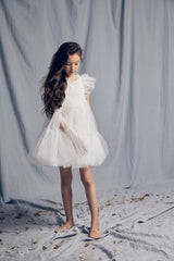 White tulle flower girl dress with a ruffle collar