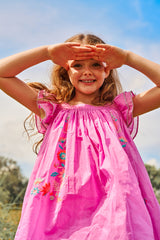 Above knee pink cotton birthday dress with embroidery and ruffle sleeves