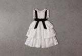 Tiered white cotton Christmas dress with velvet ribbon