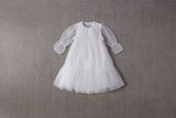 White tulle flower girl dress with ruffles