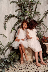 White tulle flower girl dress with ruffles
