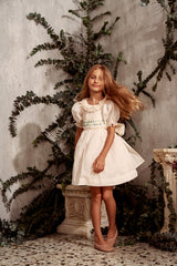 Embroidered beige cotton flower girl dress with smocking