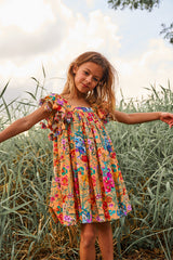Peach floral cotton birthday dress with tassels
