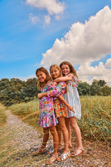 Purple cotton top with colourful flower tassels