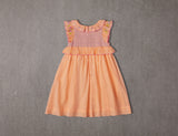 Above knee peach cotton birthday dress with floral embroidery and smocking
