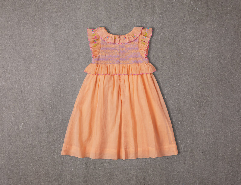 Above knee peach cotton birthday dress with floral embroidery and smocking