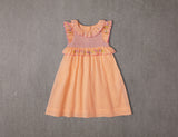 Above knee peach cotton birthday dress with floral embroidery and smocking