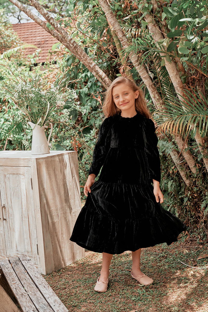 Tiered black velvet Christmas dress with gathered sleeves