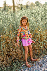 Pink cotton shorts with multi-coloured tassels