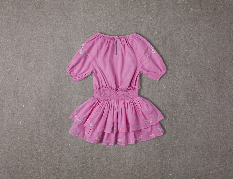 Above knee tiered pink cotton birthday dress with pompoms