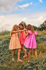 Above knee pink cotton birthday dress with smocking