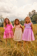 Above knee purple cotton birthday dress with floral embroidery and smocking