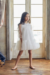 White tulle flower girl dress with ruffles