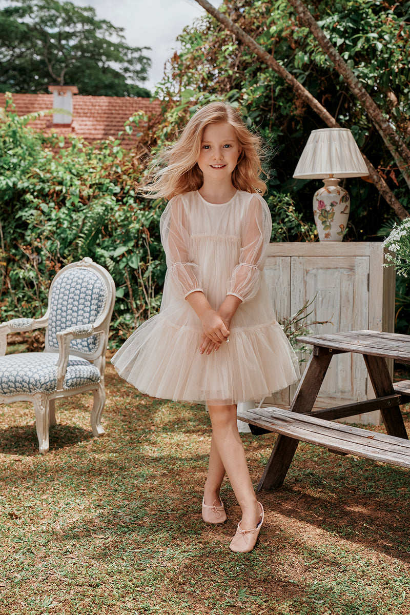 Pink tulle flower girl dress with ruffles