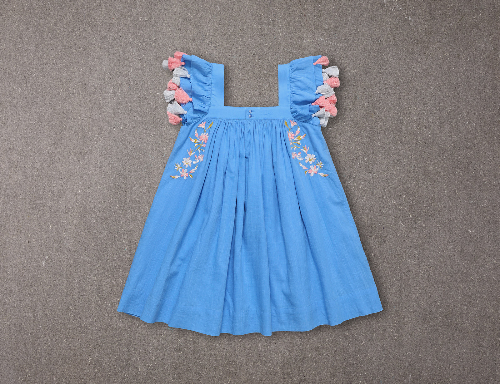 Chloe dress | Embroidered blue cotton summer dress with pompoms NELLYSTELLA Chloe dress | Embroidered blue cotton summer dress with pompoms NELLYSTELLA