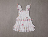 Knee length white floral cotton birthday dress with pompoms