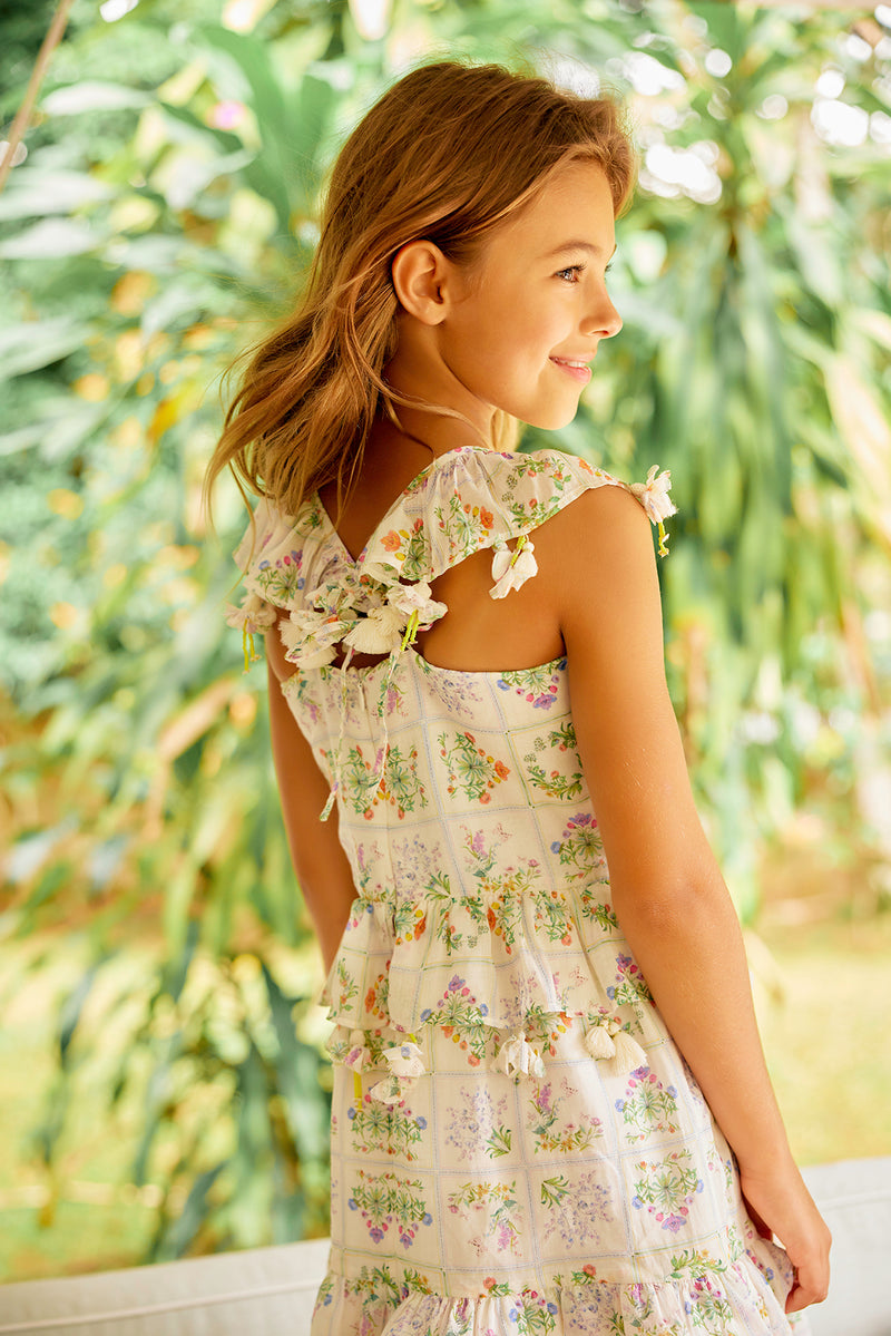 Leighton Dress | Knee length cream floral cotton birthday dress with pompoms NELLYSTELLA Leighton Dress | Knee length cream floral cotton birthday dress with pompoms NELLYSTELLA