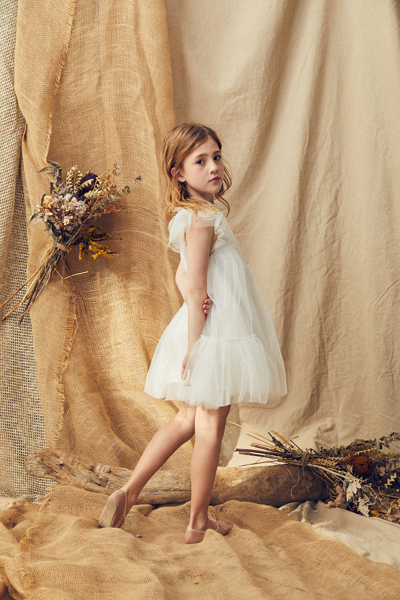 White tulle flower girl dress with a ruffle collar