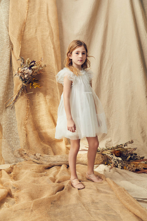 White tulle flower girl dress with a ruffle collar