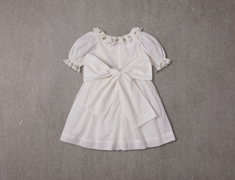 Embroidered white cotton flower girl dress with smocking