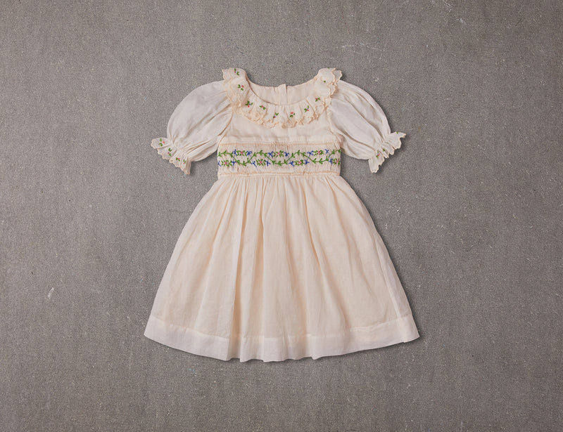 Embroidered beige cotton flower girl dress with smocking