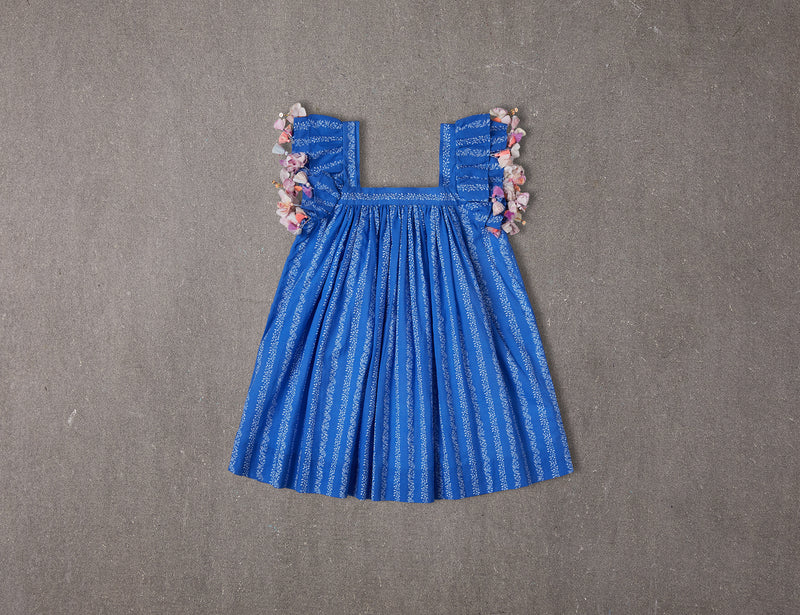 Chloe Dress | Blue floral cotton birthday dress with tassels NELLYSTELLA Chloe Dress | Blue floral cotton birthday dress with tassels NELLYSTELLA
