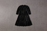 Tiered black velvet Christmas dress with gathered sleeves