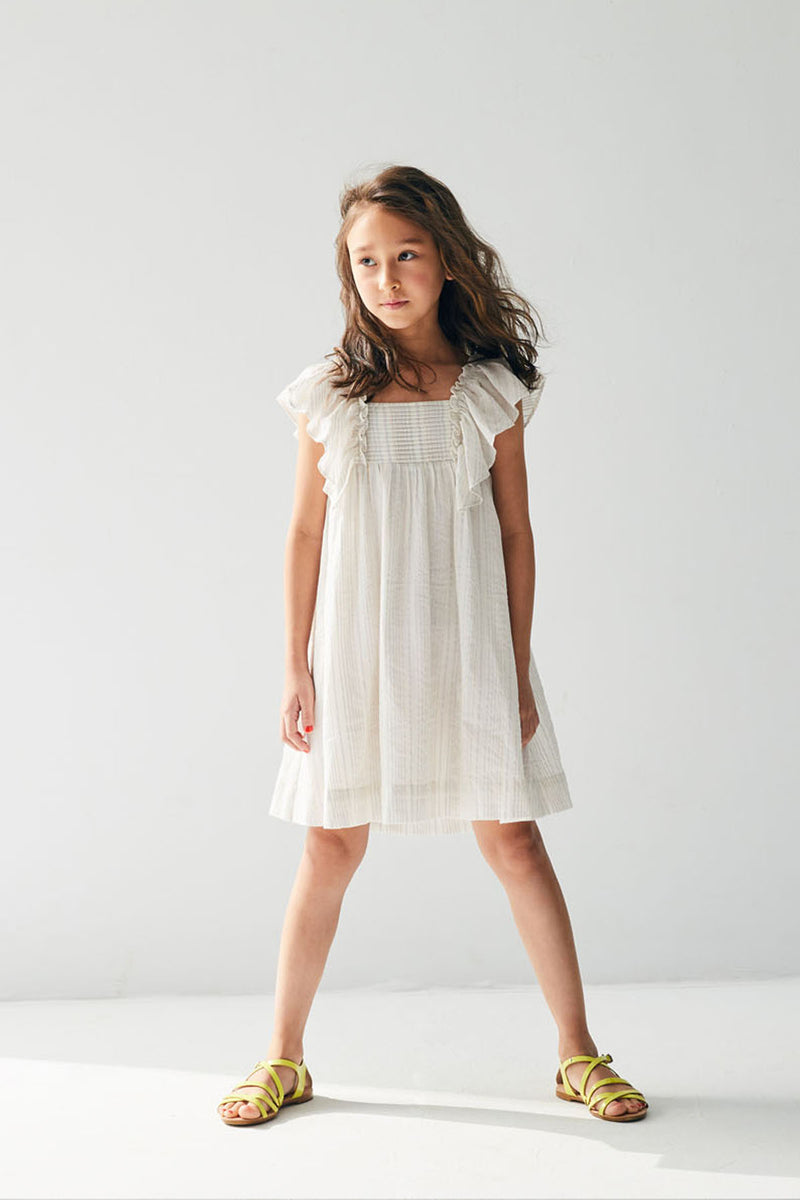 Knee length white cotton summer dress with pleats