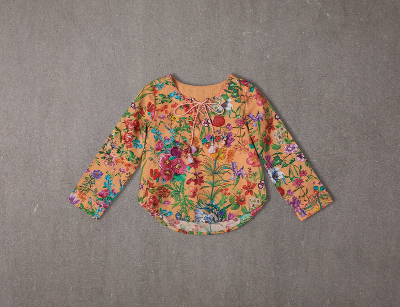 Peach cotton top with colourful flower tassels 