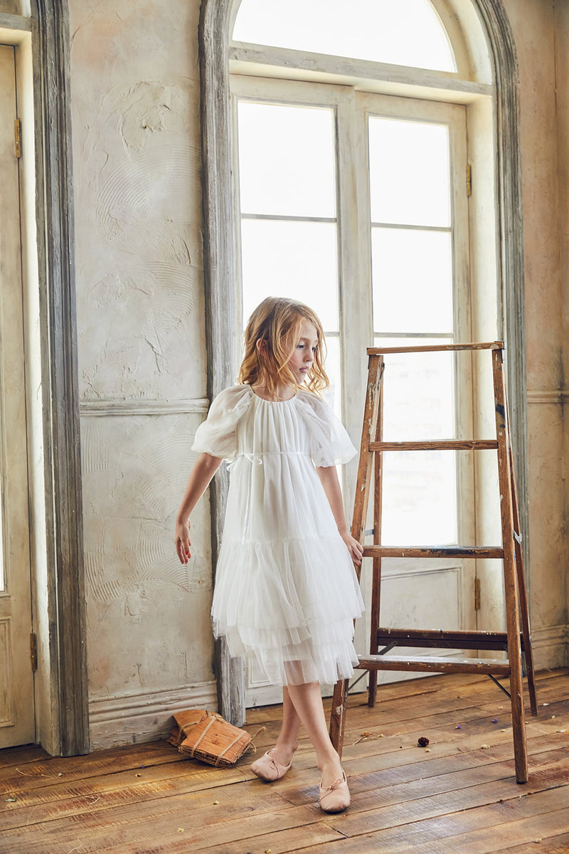 White tulle flower girl dress with puff sleeves