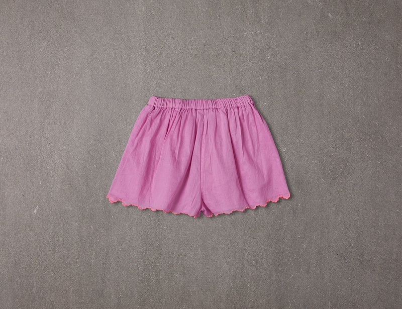 Pink cotton shorts with multi-coloured tassels